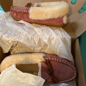 Brand new moccasin style slippers. Very cozy and fashionable. Never worn.